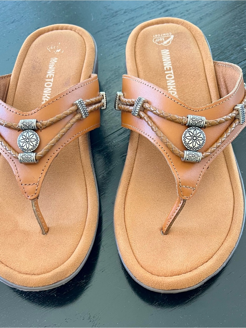 Minnetonka Tan Braided Leather Thong Sandals with Silver Conchos.  Size 8 wide.